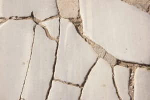 Close-up of a cracked stone pavement.