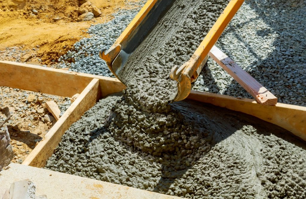 Concrete pouring at construction site.