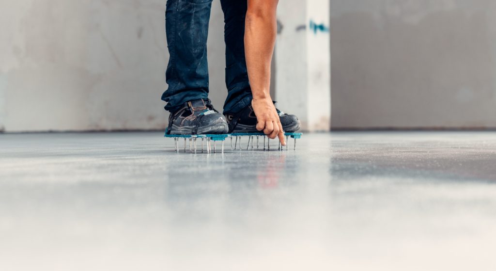 Person balancing on nails for confidence-building activity.