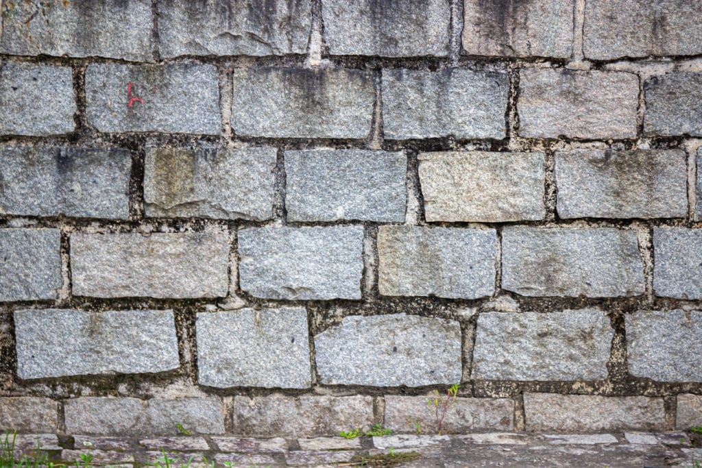 Weathered gray stone wall texture