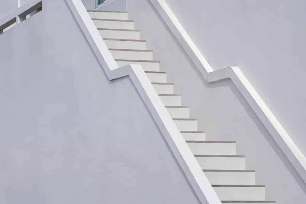 White staircase on minimalist exterior wall