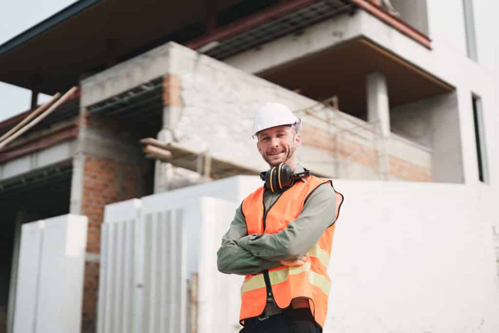 Construction worker smiling on building site